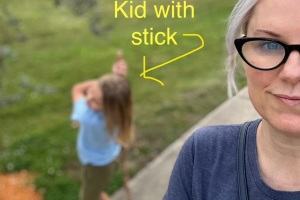 little boy with stick